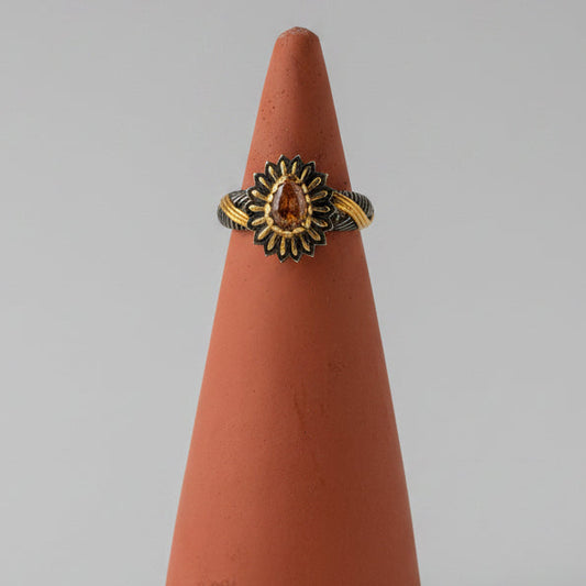 One of one pale pink tourmaline teardrop ring set inside darkened petal halo in sterling silver by Kismet Society — size 6.25