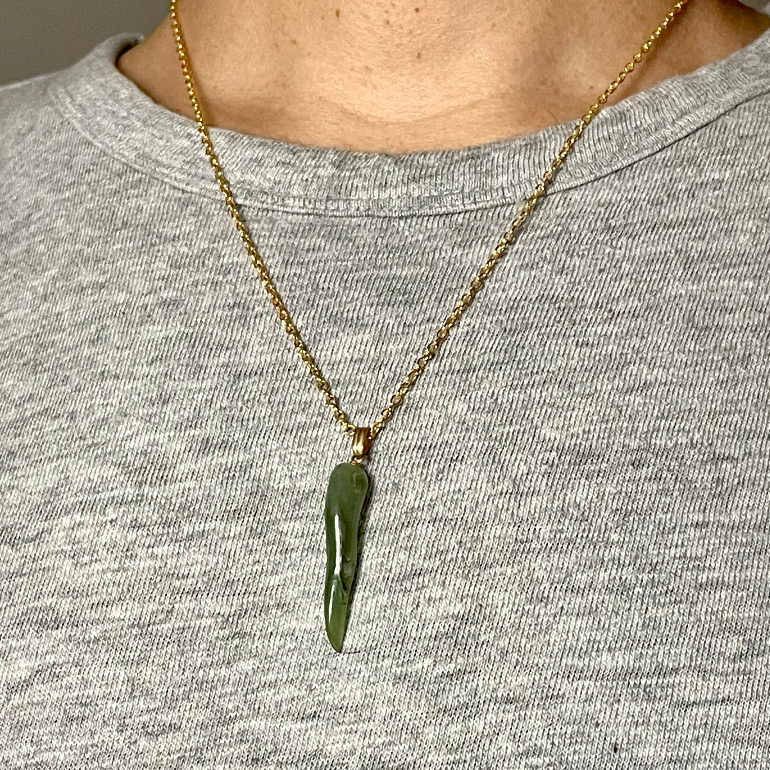1970s vintage green jade cornicello pendant on a gold chain necklace