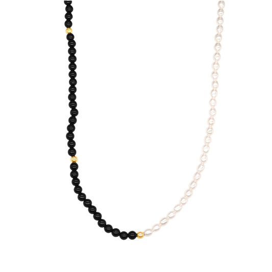 14k gold necklace, featuring a luminous rice-shaped AAA+ freshwater pearl paired with sleek Black Onyx.