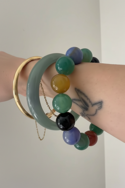 Close up of The Everyday multicolor stretch bracelet worn on wrist, Kismet Society fine jewelry
